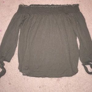 A green off the shoulder top